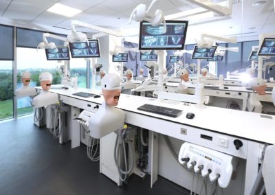 Dentsply Sirona Academy mannequin stations with x-ray displays