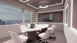 Una sala de reuniones vacía con un ordenador portátil sobre una mesa y una pantalla en la pared del fondo